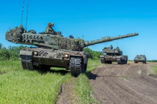 Two Leopard 2 tanks and a Badger Armoured Engineer